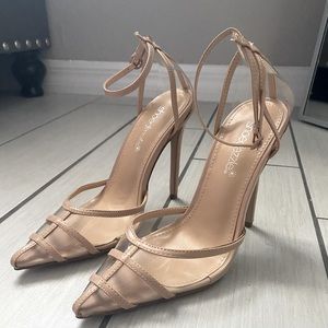 Nude/ clear pointed toe heels.